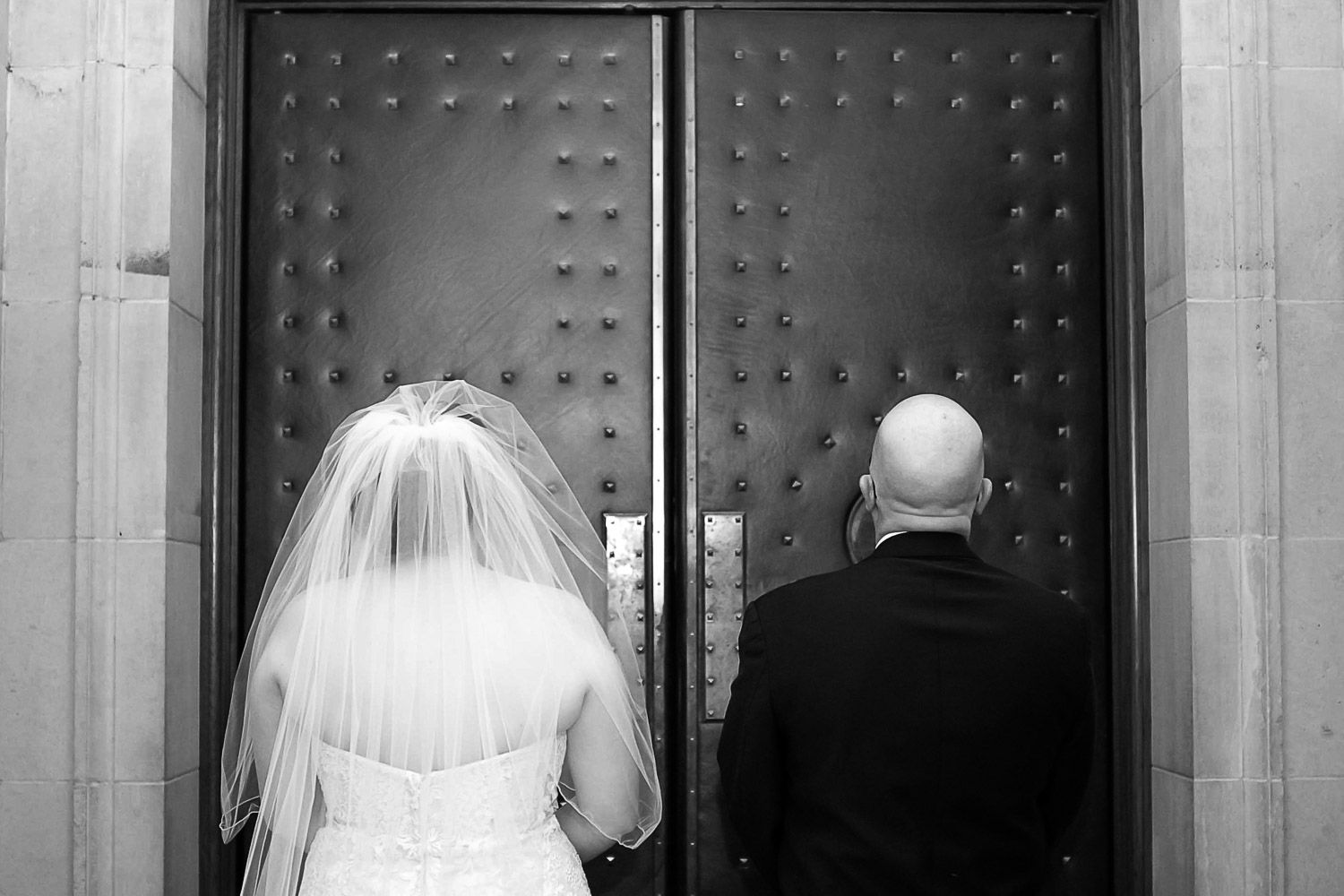 bride and dad getting ready to walk down the aisle at The Basilica of Saint Mary
