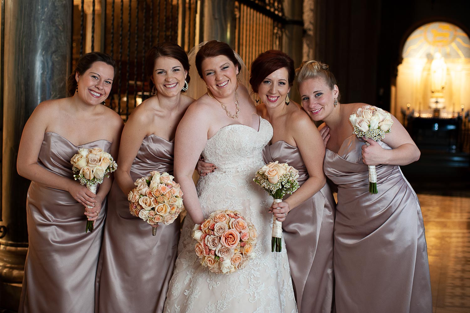 bride with her bridesmaids at The Basilica of Saint Mary
