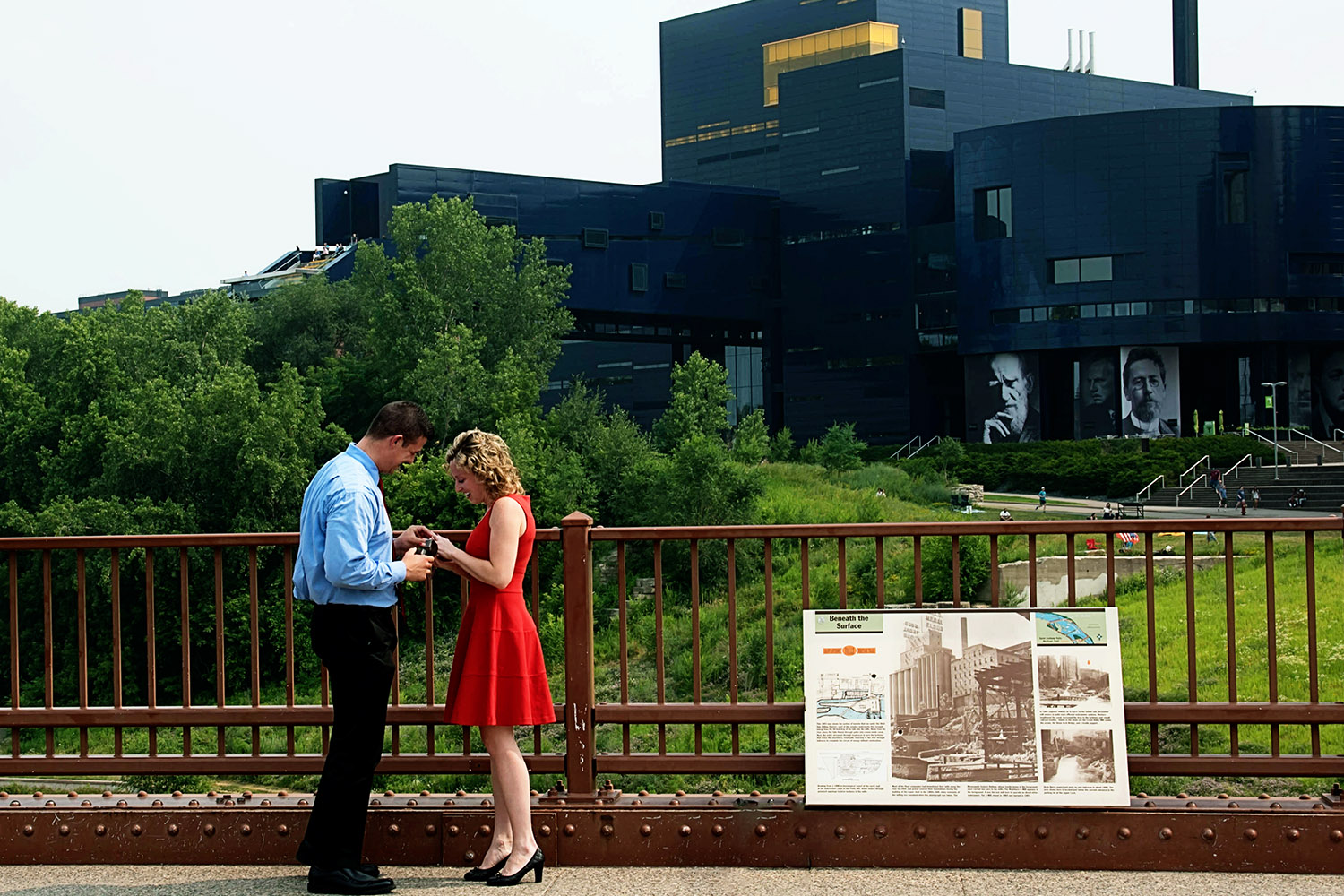 couple looking at the engagement ring after the surprise proposal