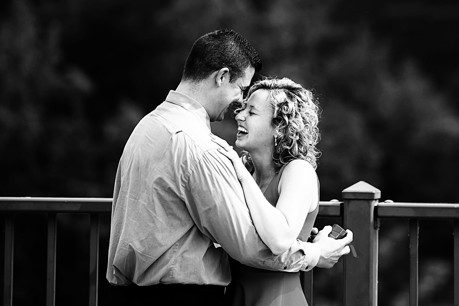 newly engaged couple on the stone arch bridge