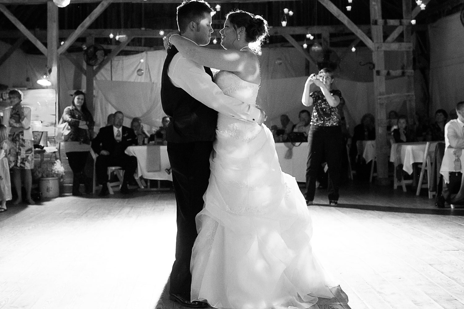 bride and groom first dance at their wedding reception at the Enchanted Barn in Wisconsin
