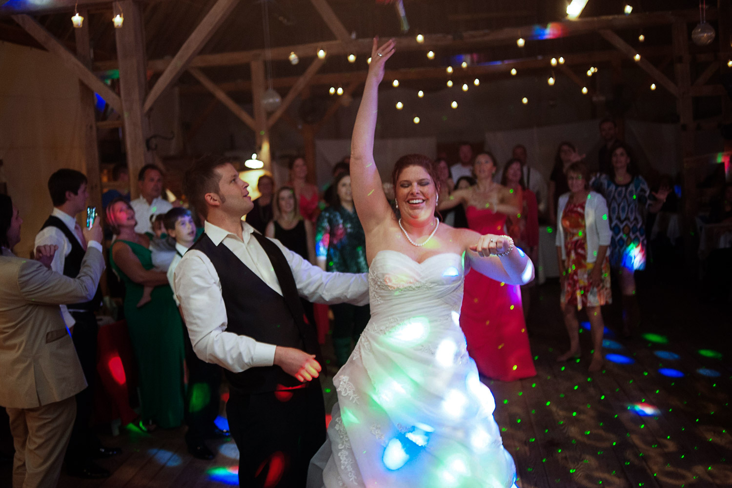 bouquet toss at the Enchanted Barn wedding