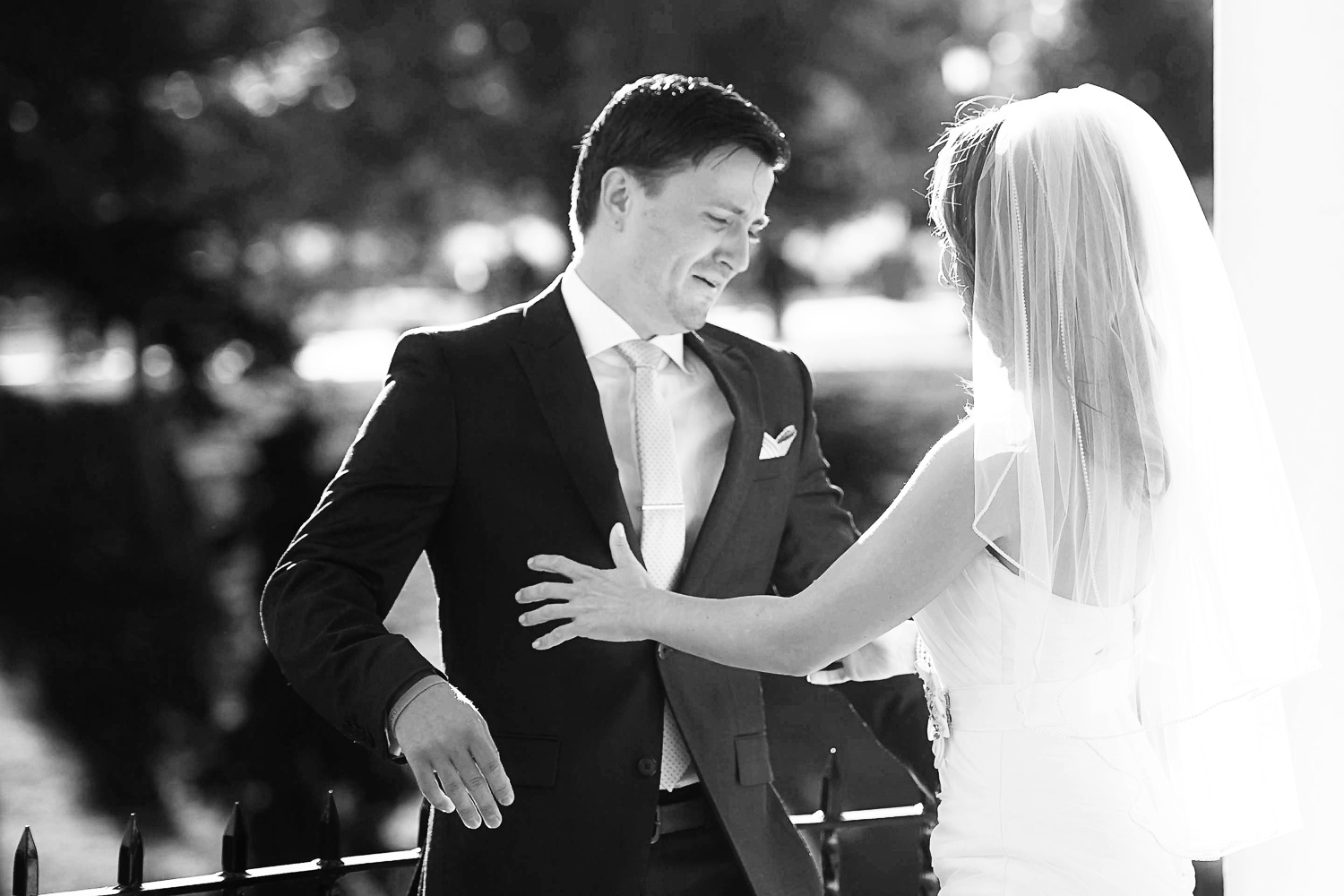emotional groom seeing his bride on their wedding day