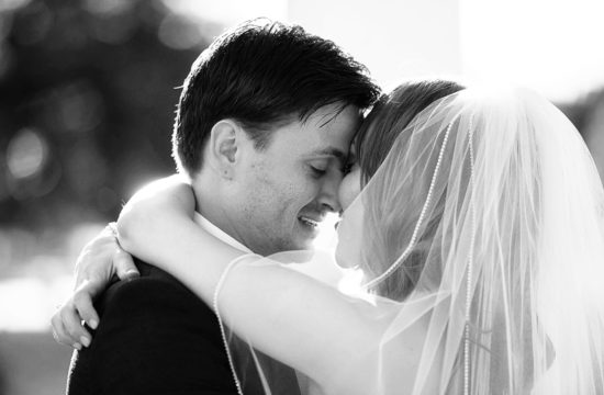bride and groom touching foreheads before their wedding at the Como Zoo in St Paul