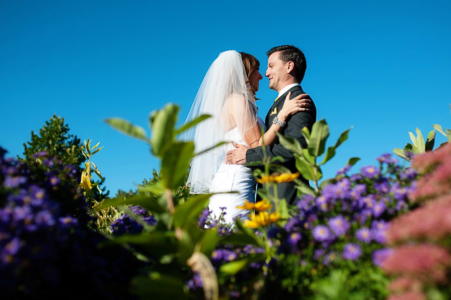 bride and groom in the garden before their Como Zoo wedding