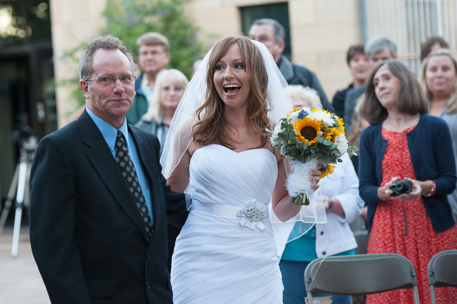 bride walking down the aisle at her Como Zoo wedding