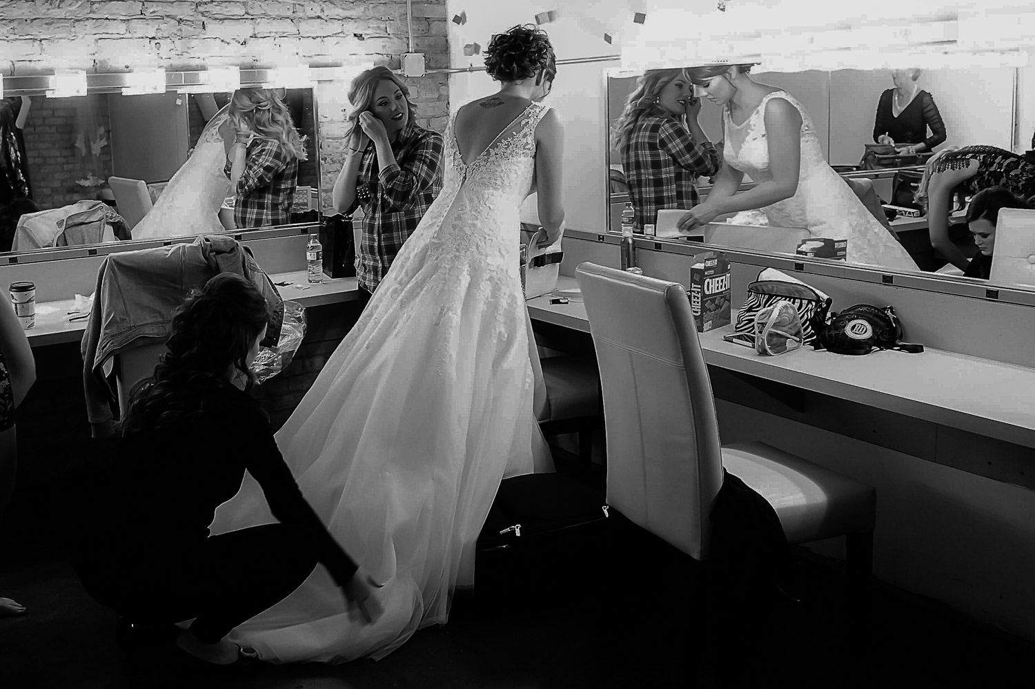 bride looking at herself in the mirror at Aria in Minneapolis