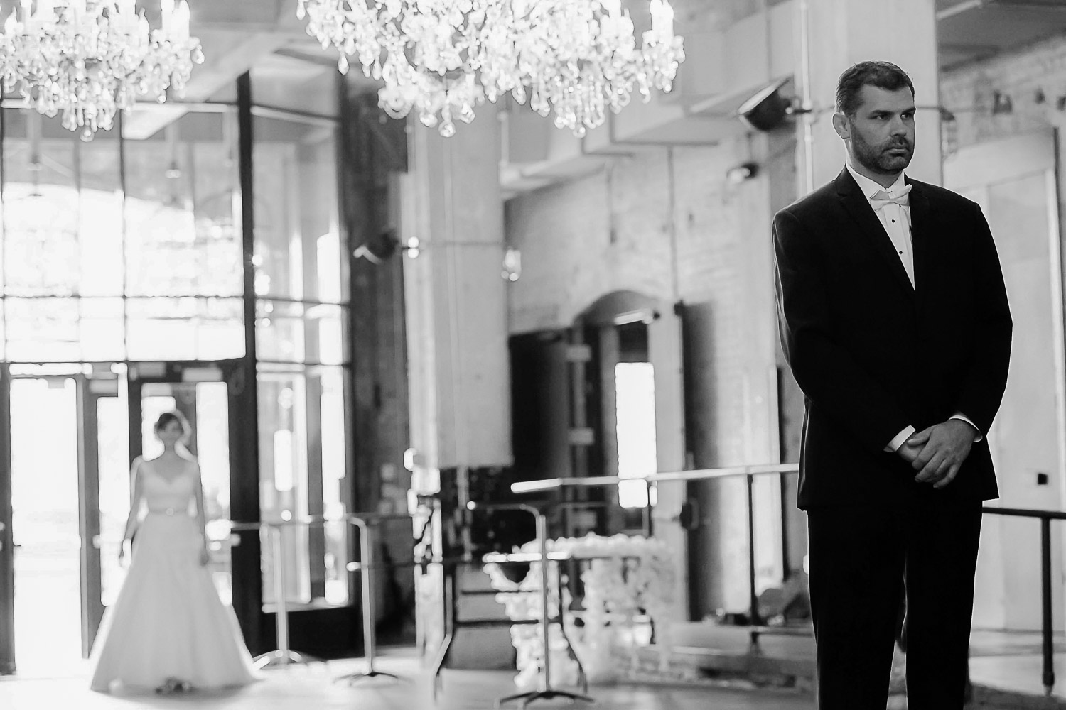 groom waiting for his bride for their first look at Aria in Minneapolis
