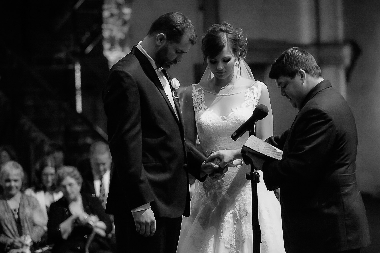 bride and groom holding hands during their ceremony at Aria in Minneapolis
