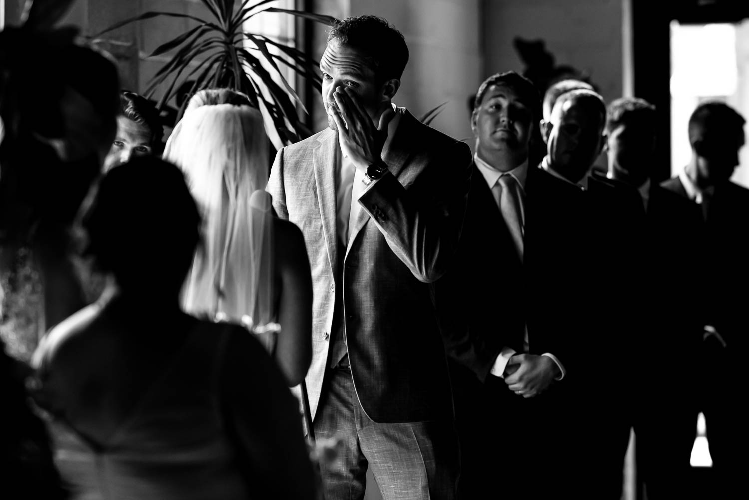 groom crying during wedding vows in St. Paul Minnesota at their wedding venue Paikka