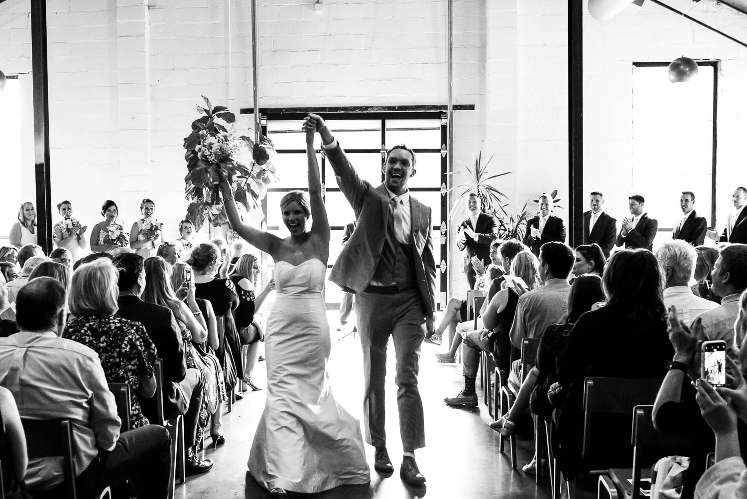 groom and bride recessional at their wedding in St.Paul at Paikka