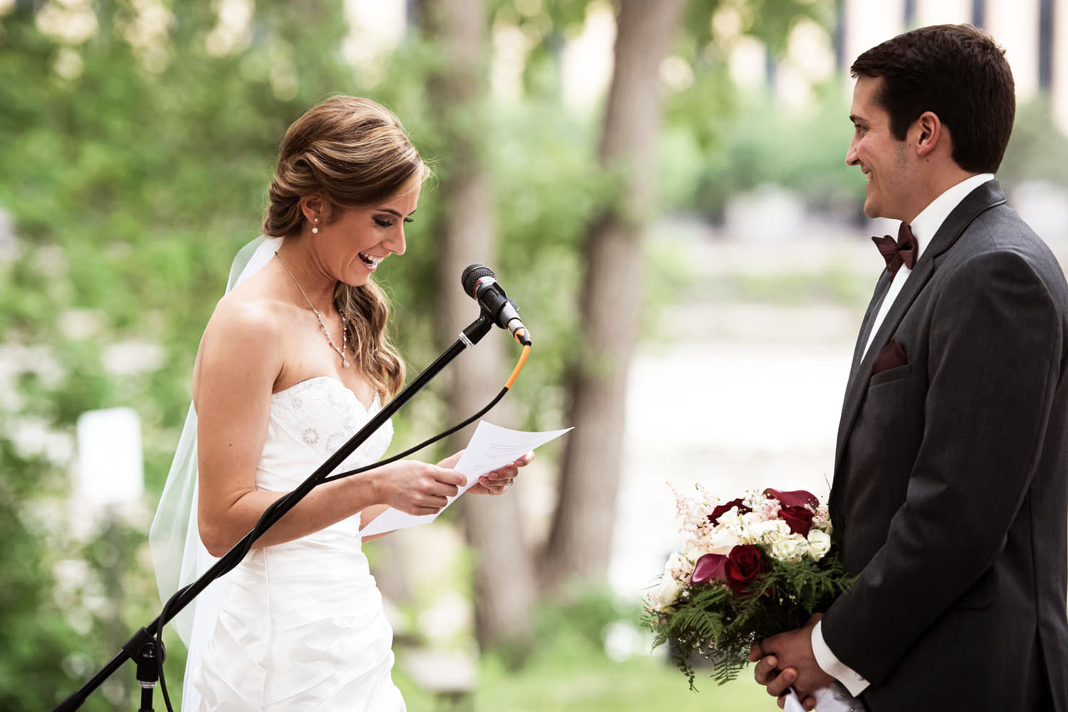 Bride reading vows to Groom at Nicollet Island Wedding