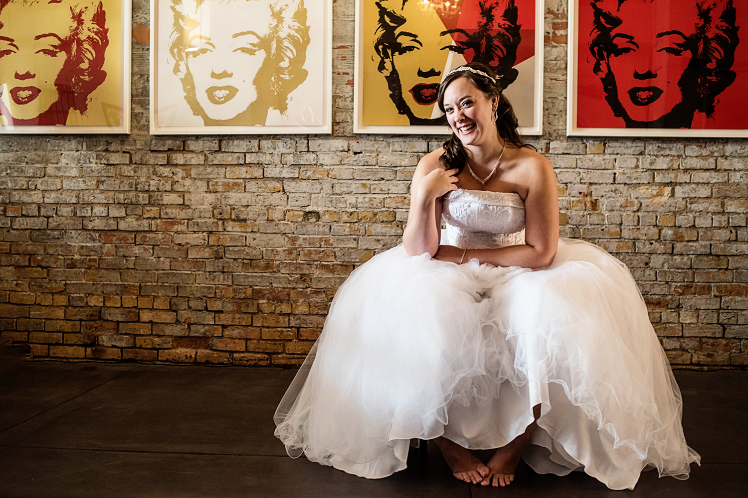 barefoot bride in front of Marilyn Monroe pop art at one of my 30 favorite venues in minneapolis 