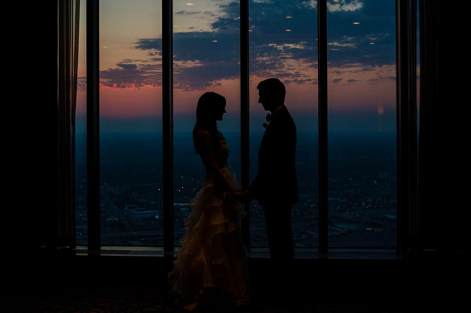 bride and groom silhouette on top of the IDS center in Windows