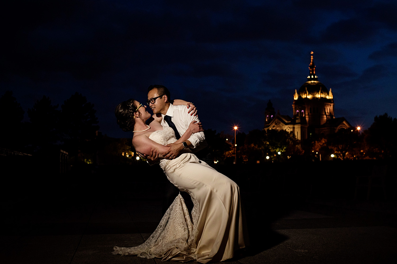 bride and groom outside with the cathedral st paul in the background