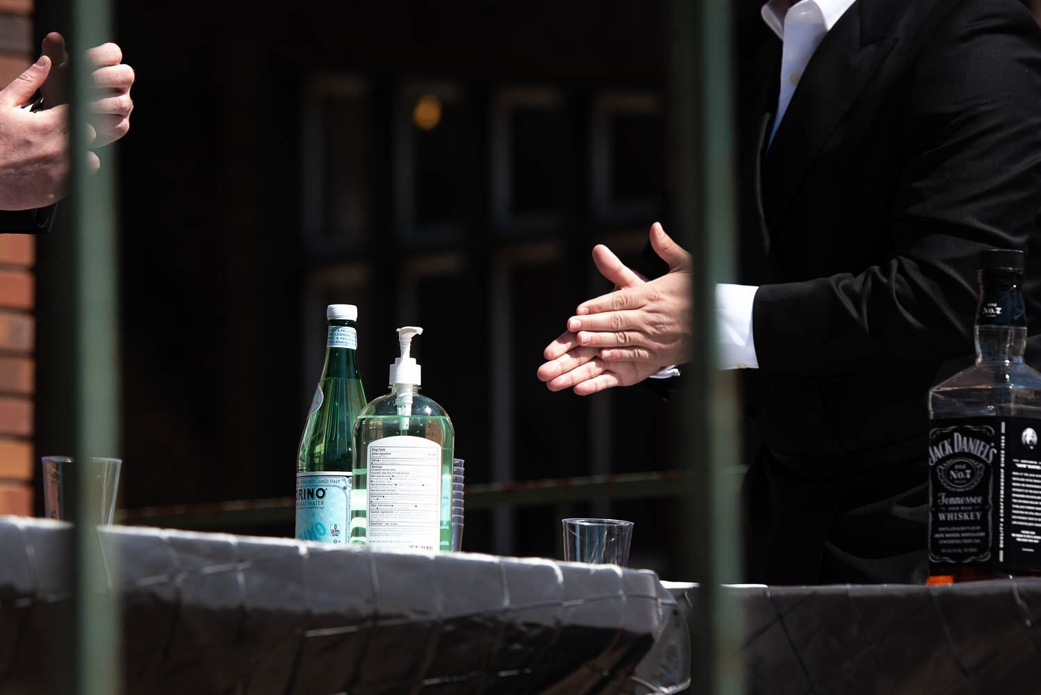 Jewish groom using hand sanitizer before his Covid-19 wedding