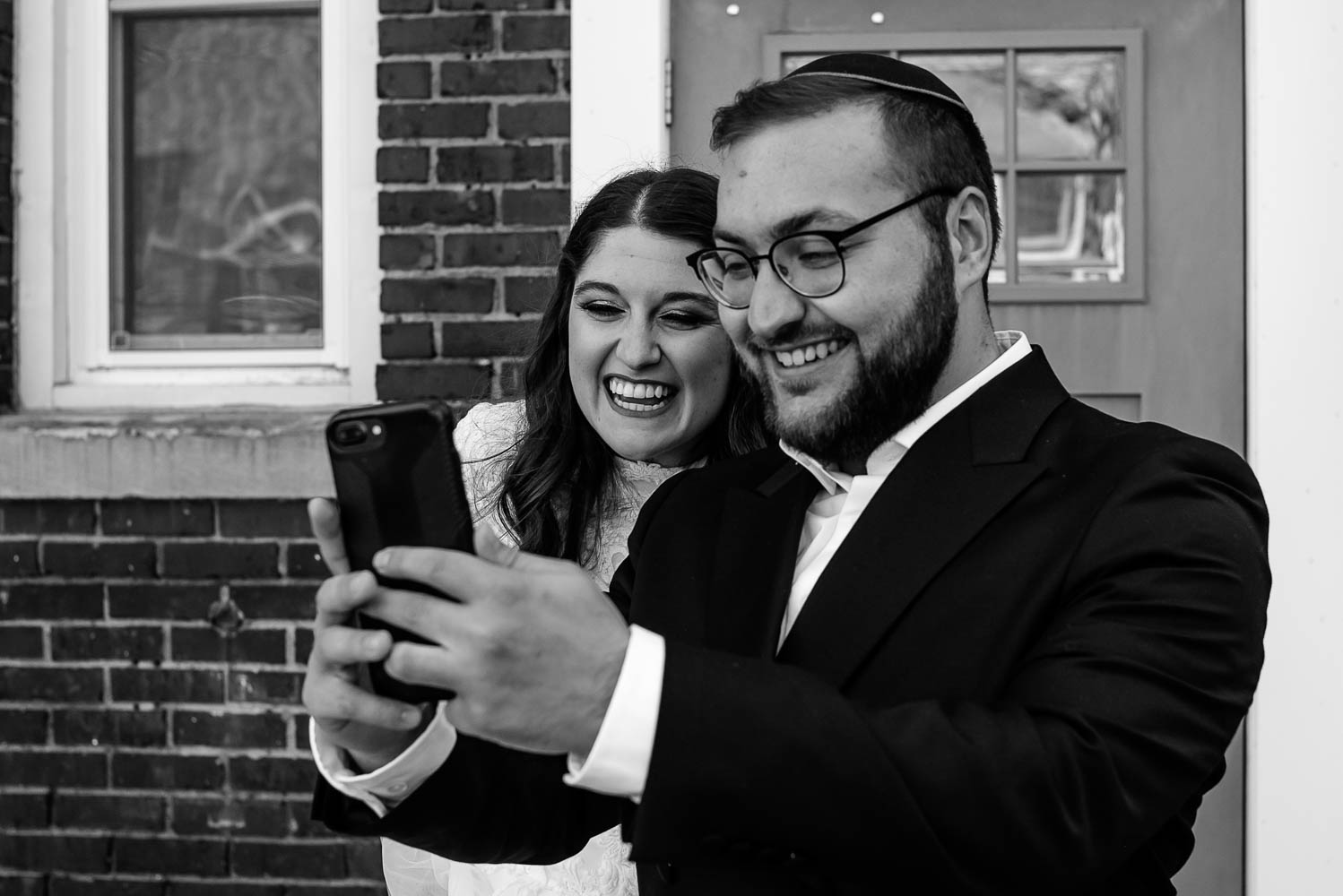 Jewish couple talking to family on Zoom after their Covid-19 wedding