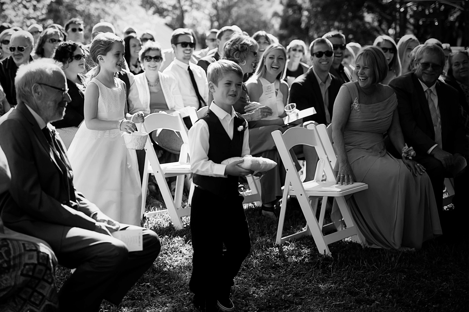 flower girl and ring bearer walking down the aisle