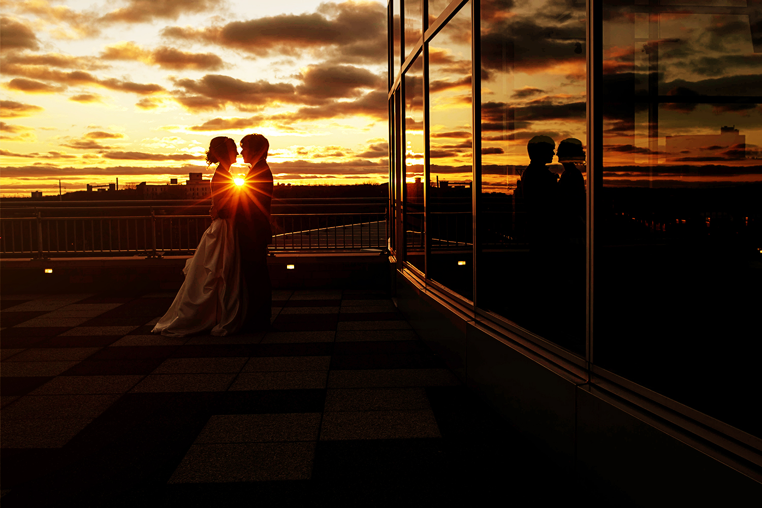 bride and groom at sunset on the balcony of the science museum one of my favorite venues in minneapolis and st paul