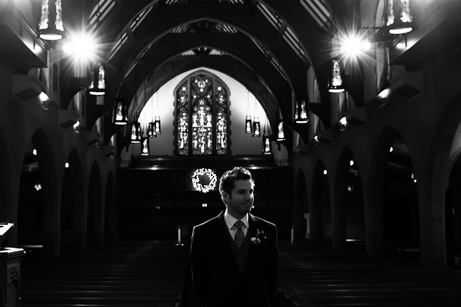 groom waiting to see his bride for the first look on their wedding day