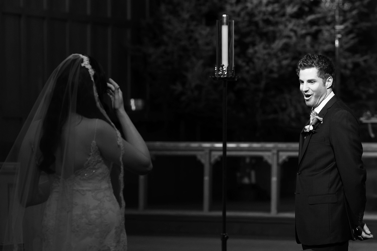 Groom seeing his bride for the first time on their wedding day