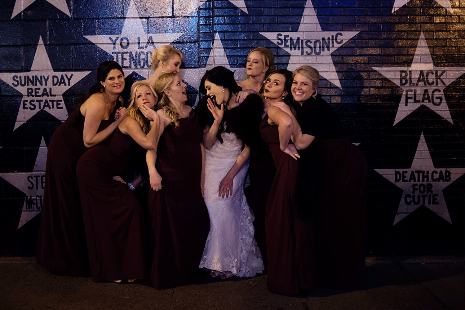 bride with bridesmaids in front of First Avenue in Minneapolis