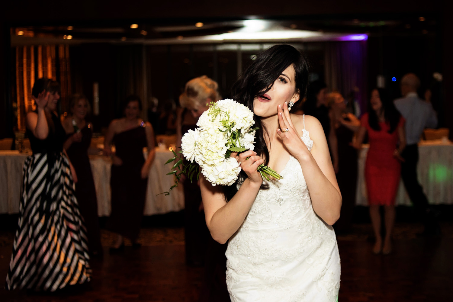 bride getting ready to throw the bouquet