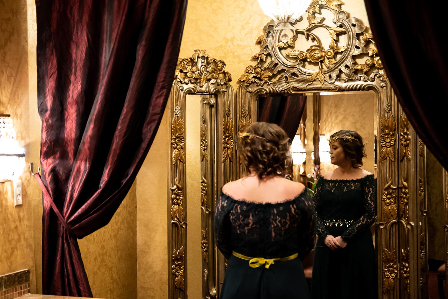 bride looking at herself in the mirror at the St Paul hotel