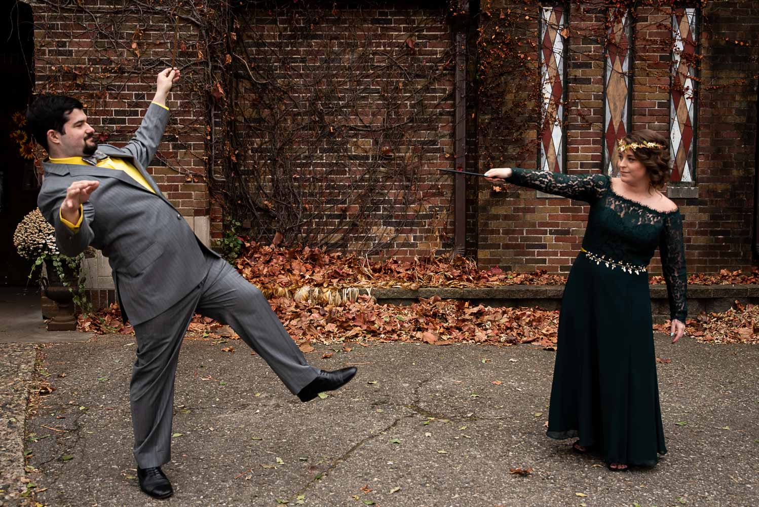 Hufflepuff groom and Slytherin bride dueling with magic wands