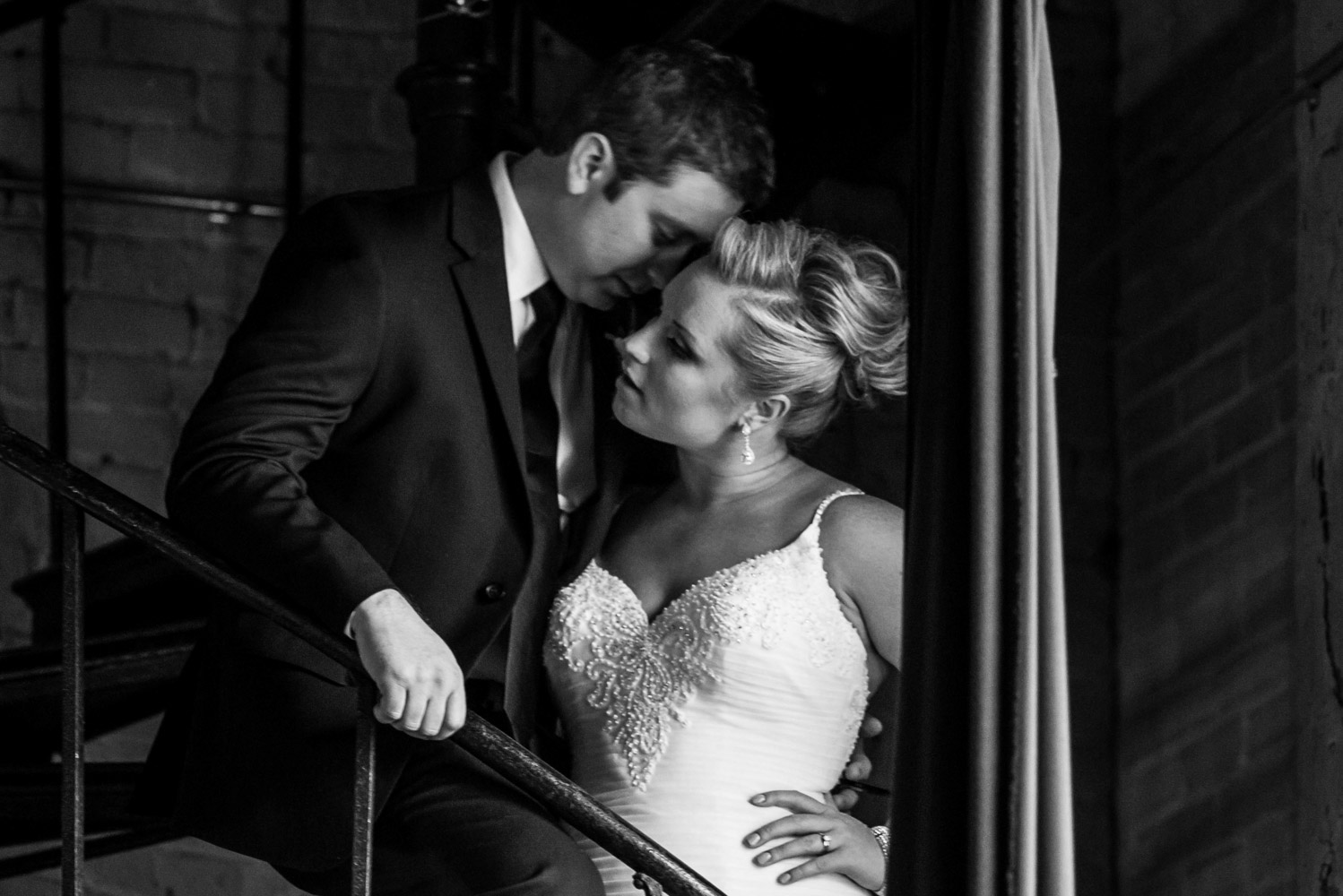 bride and groom standing on the stairs at Aria in Minneapolis