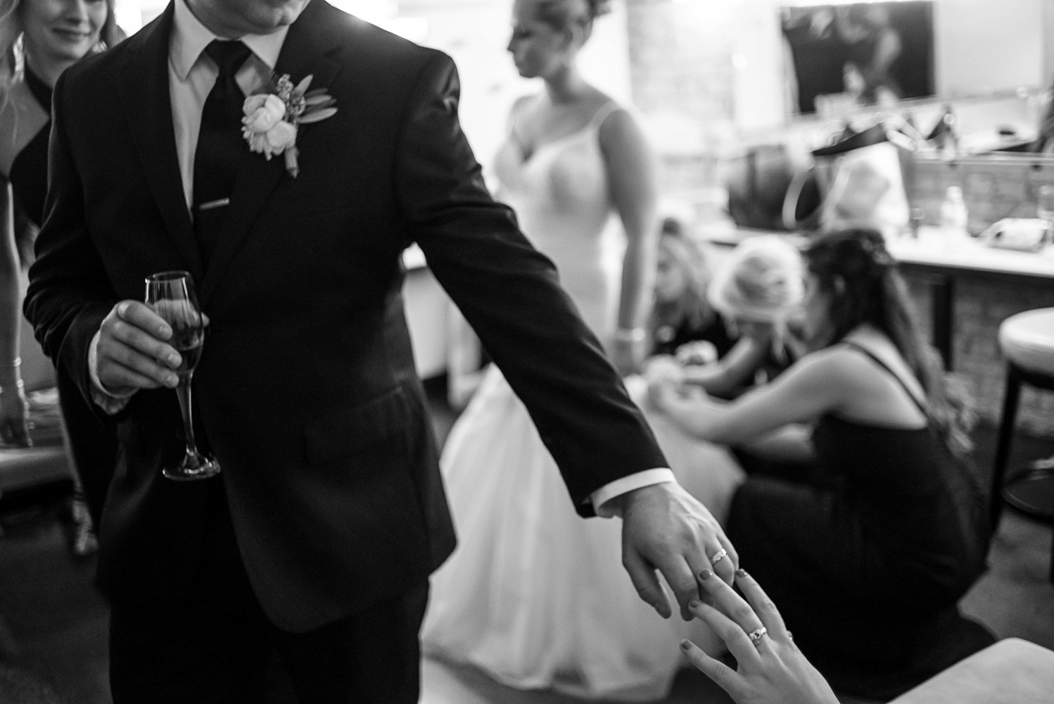 groom showing off his wedding ring at Aria