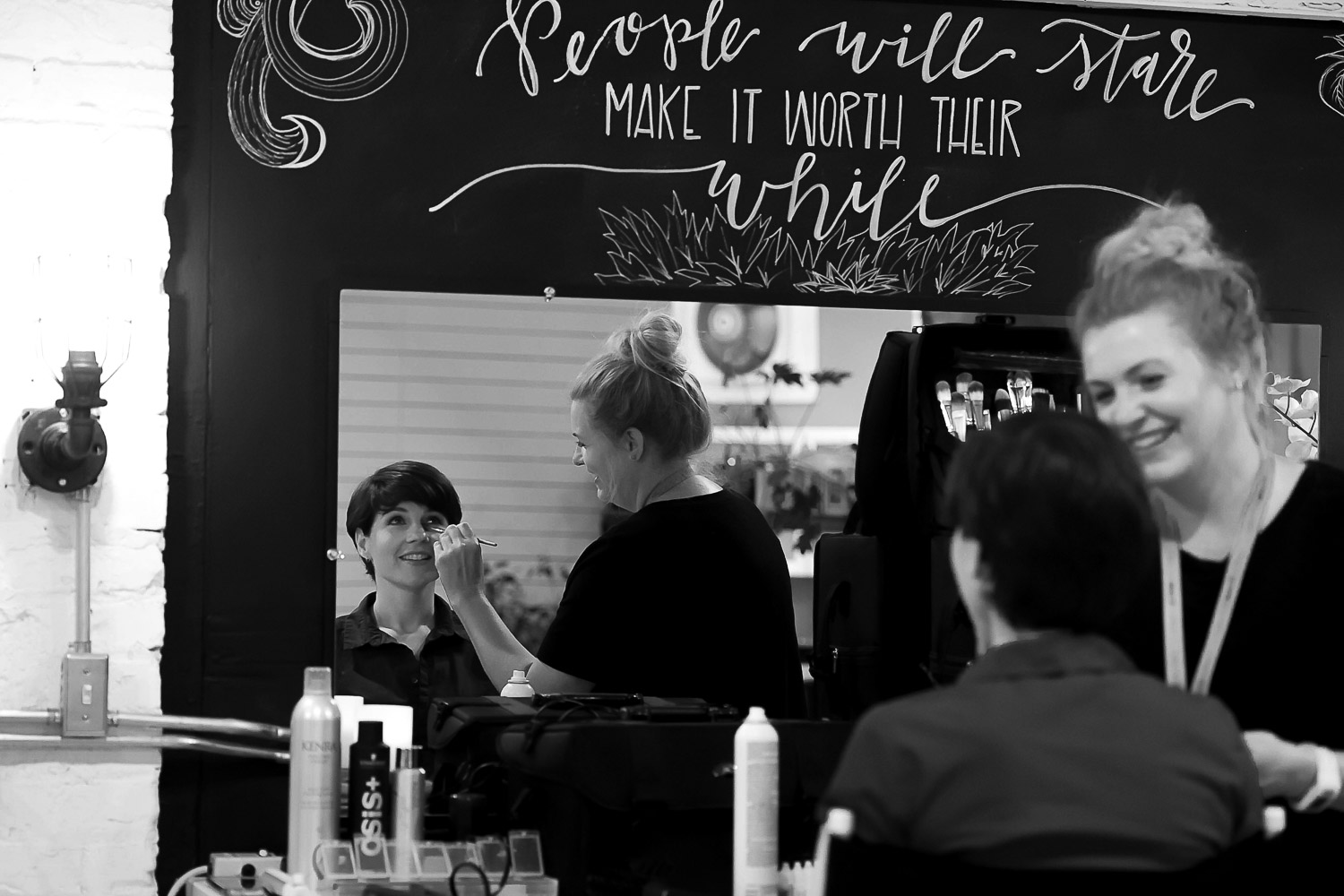 bride getting her makeup on in the dressing room at Neu Neu in Minneapolis