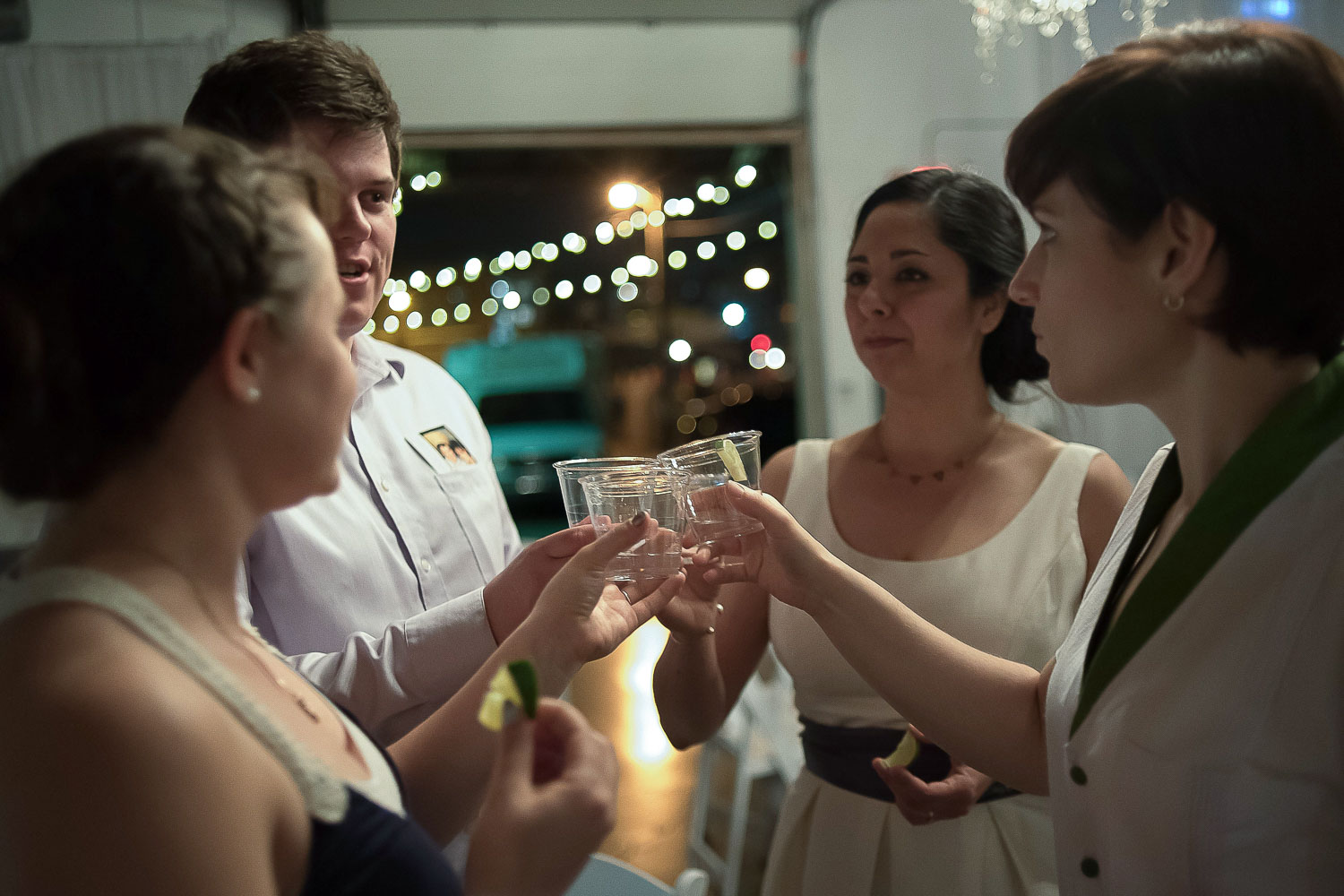 same sex couple toasting with their wedding guests at Neu Neu in Minneapolis