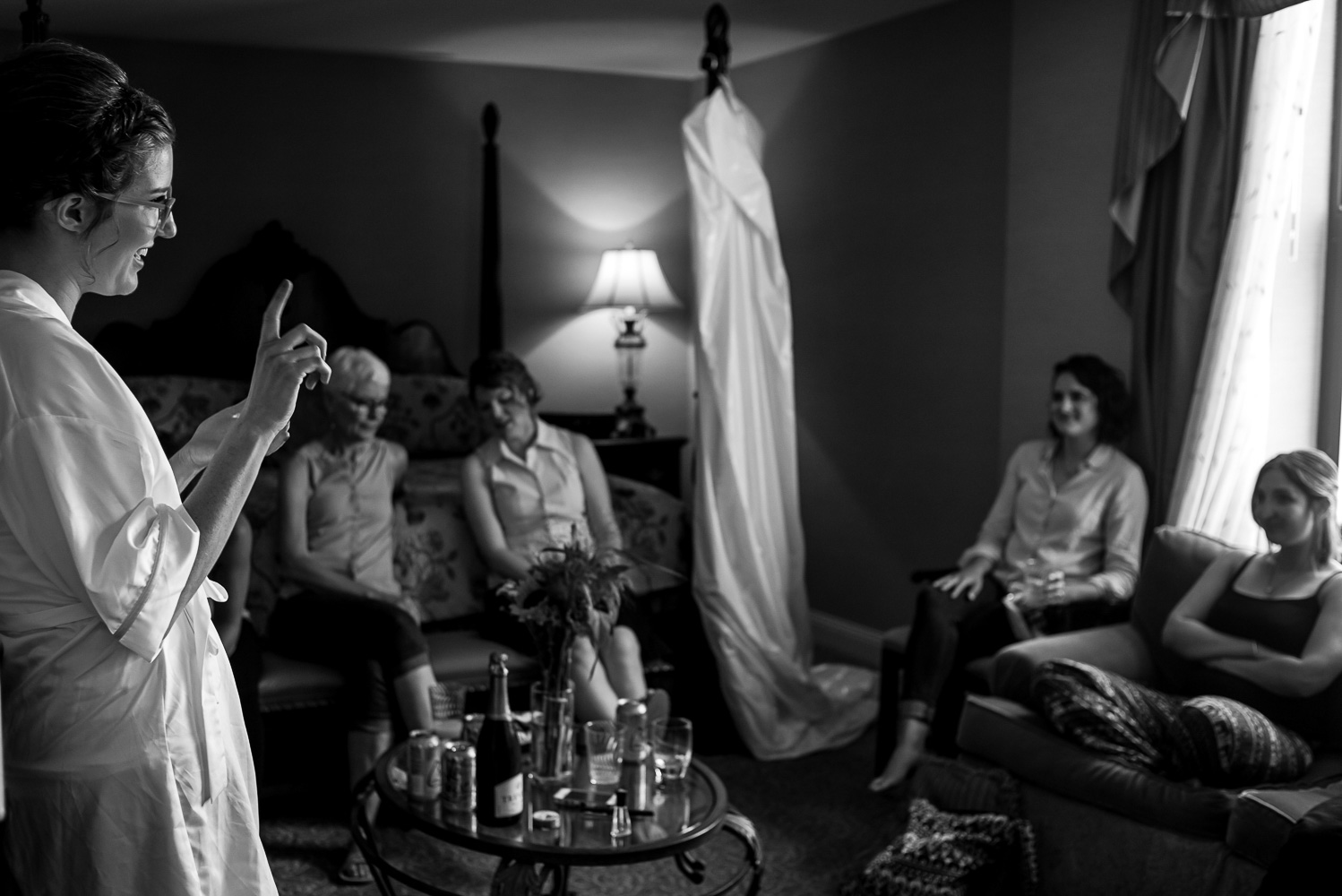 bride getting ready to put on her dress in the hotel room at the St Paul Hotel