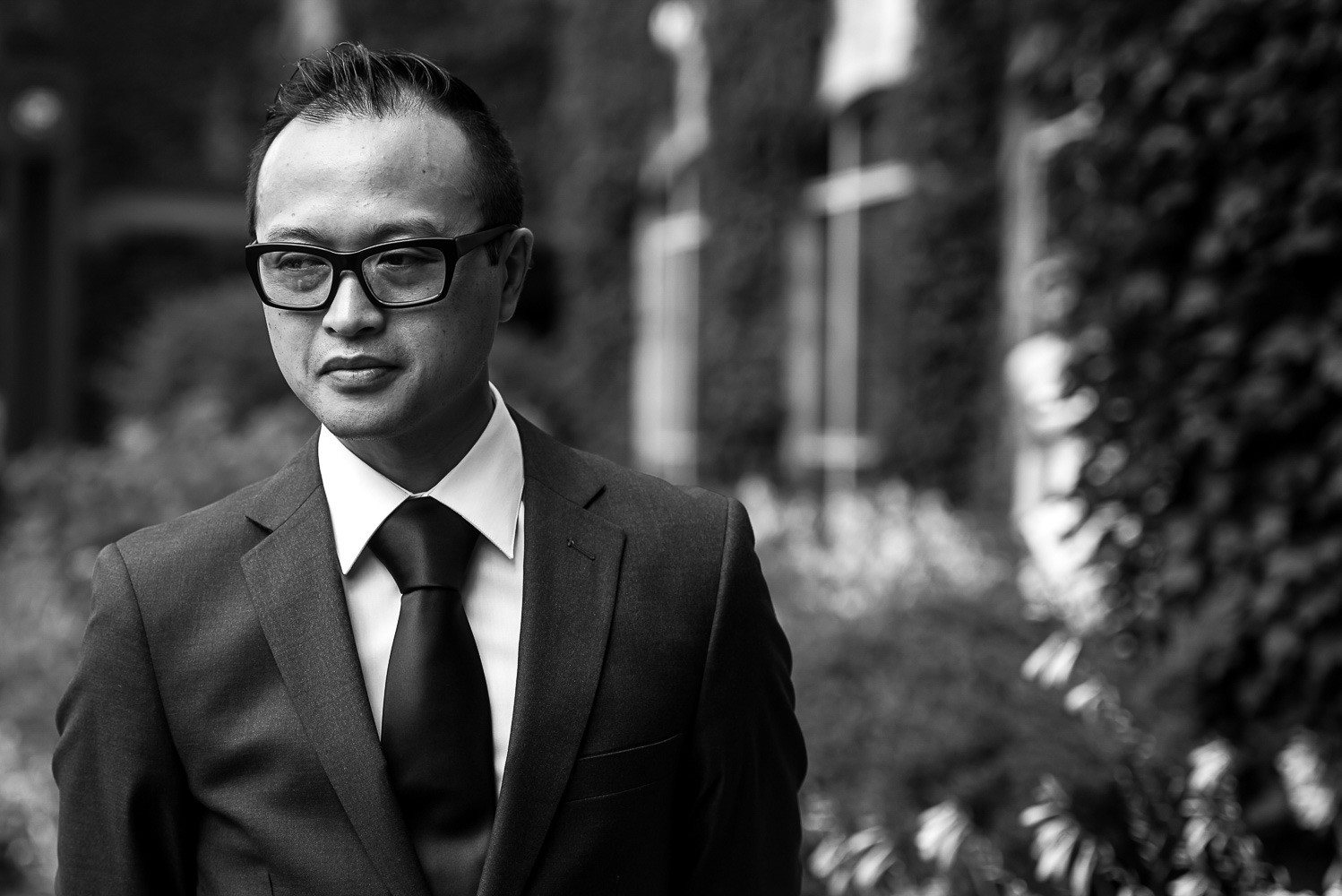 groom waiting for the bride for their first look in the garden of St Paul hotel