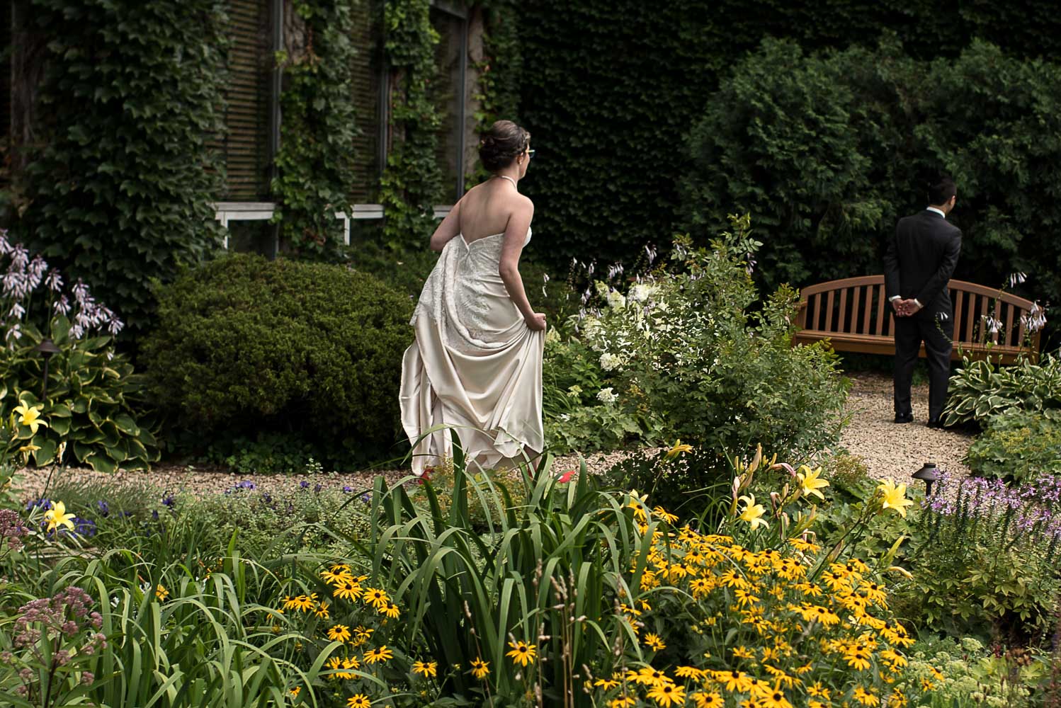 bride walking to meet groom for the first look
