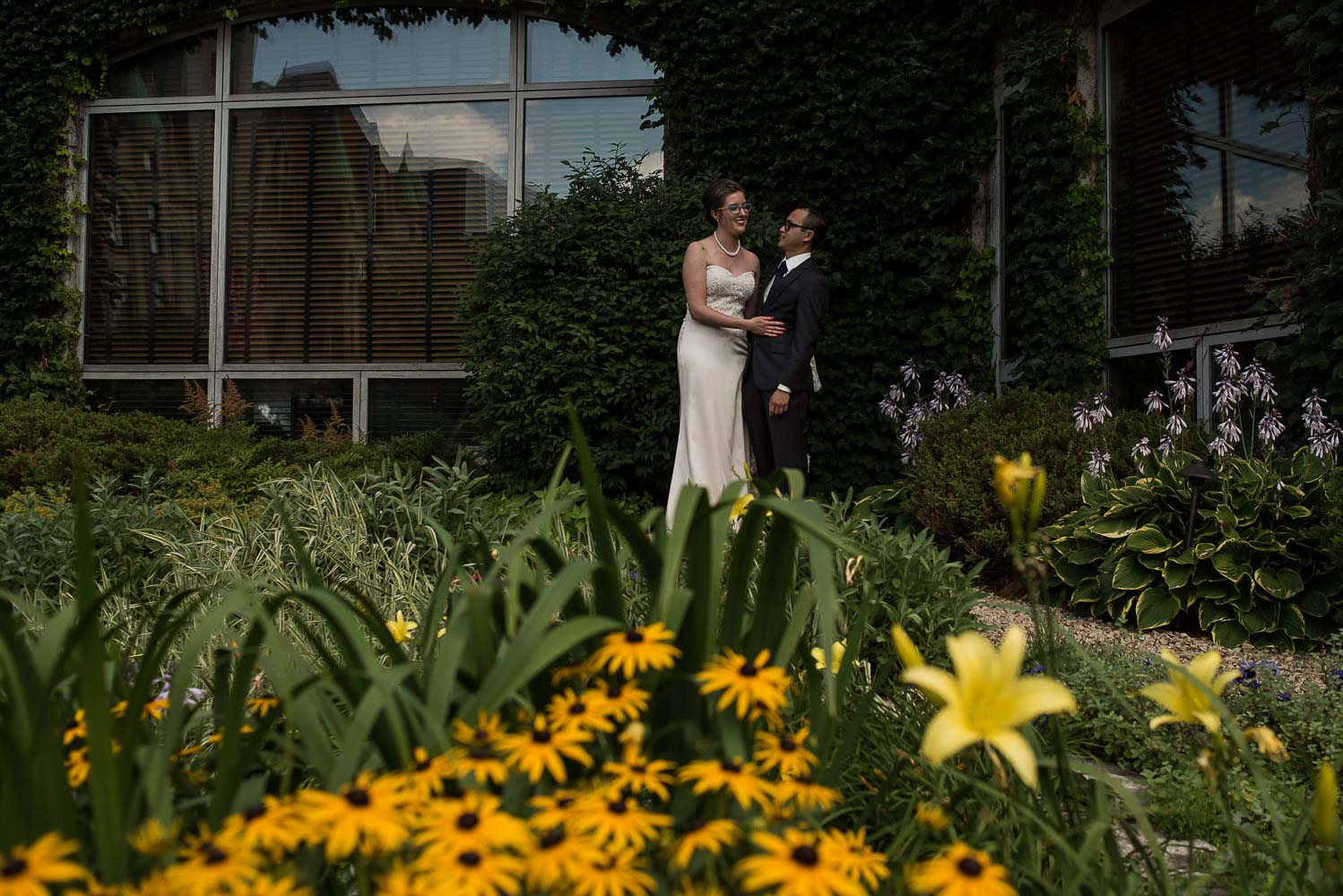 bride and groom portrait in the St Paul hotel garden with yellow flowers