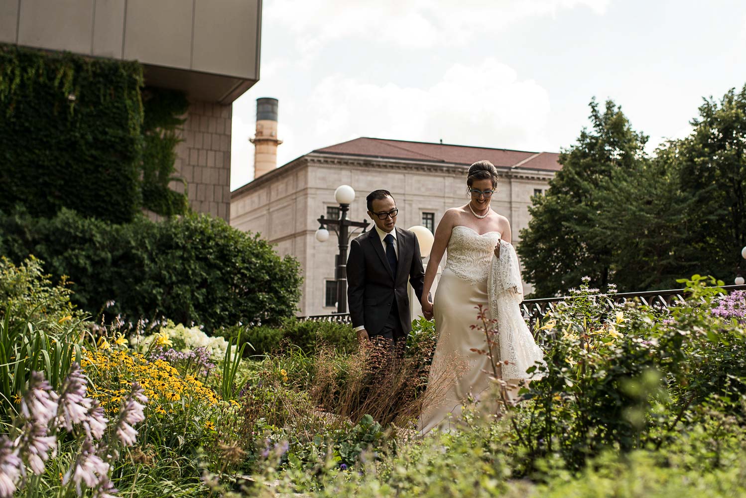 bride and groom walking in the St Paul hotel garden