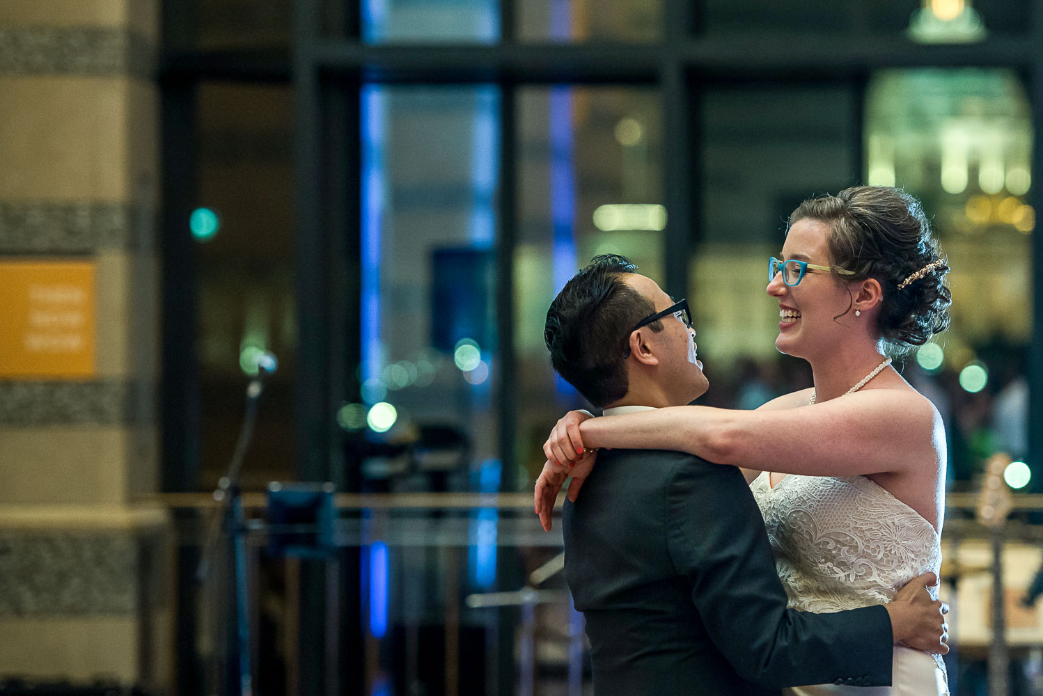 bride and groom's first dance at the Minnesota History center with a view of the Capital