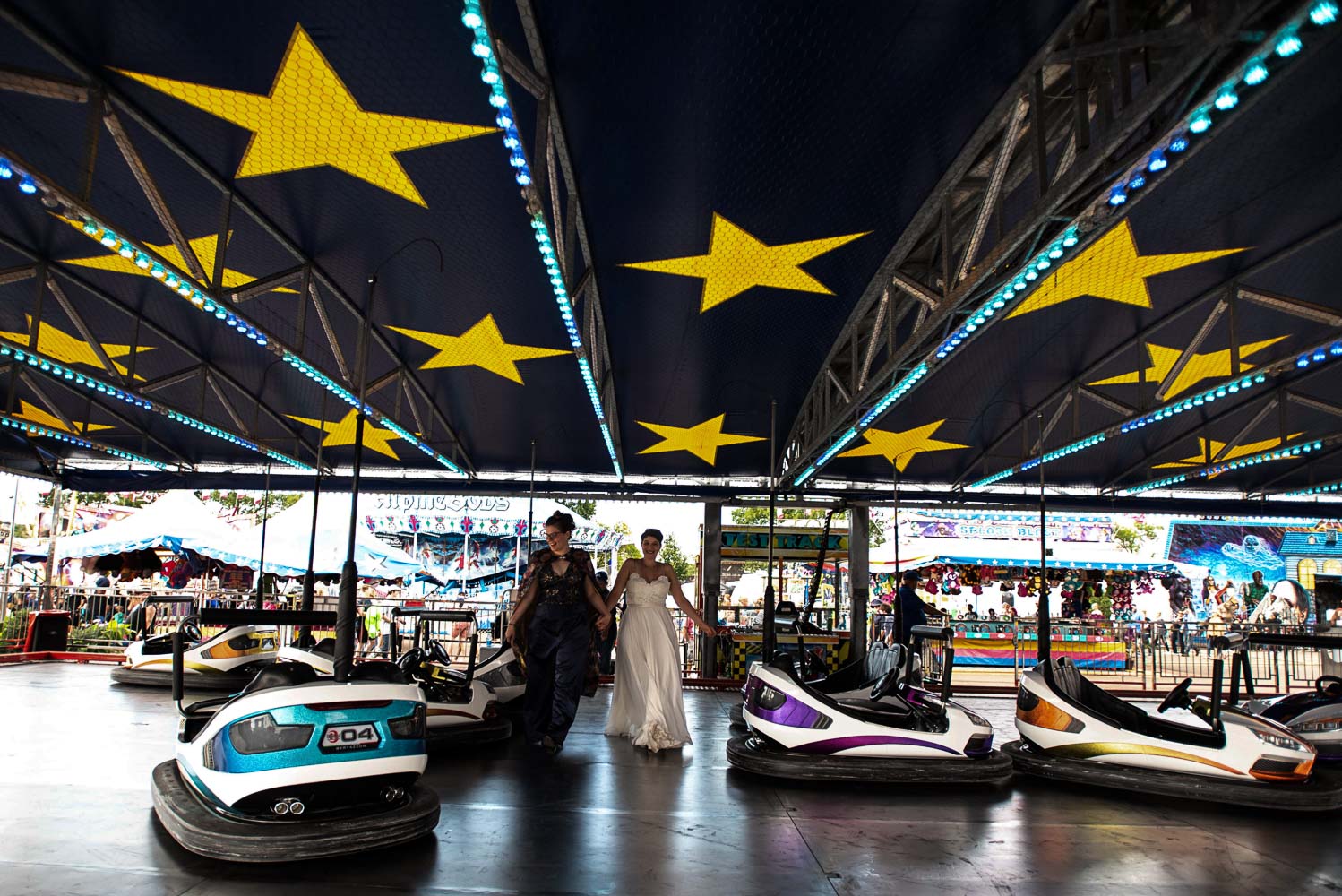 queer couple on the bumper cars at the Minnesota State Fair
