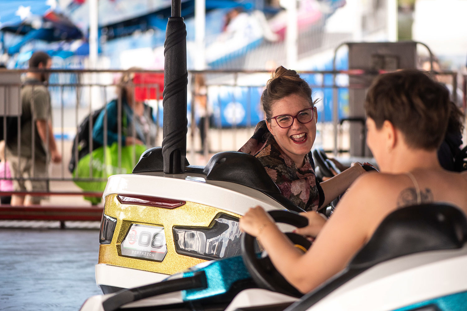queer couple on the bumper cars at the Minnesota State Fair