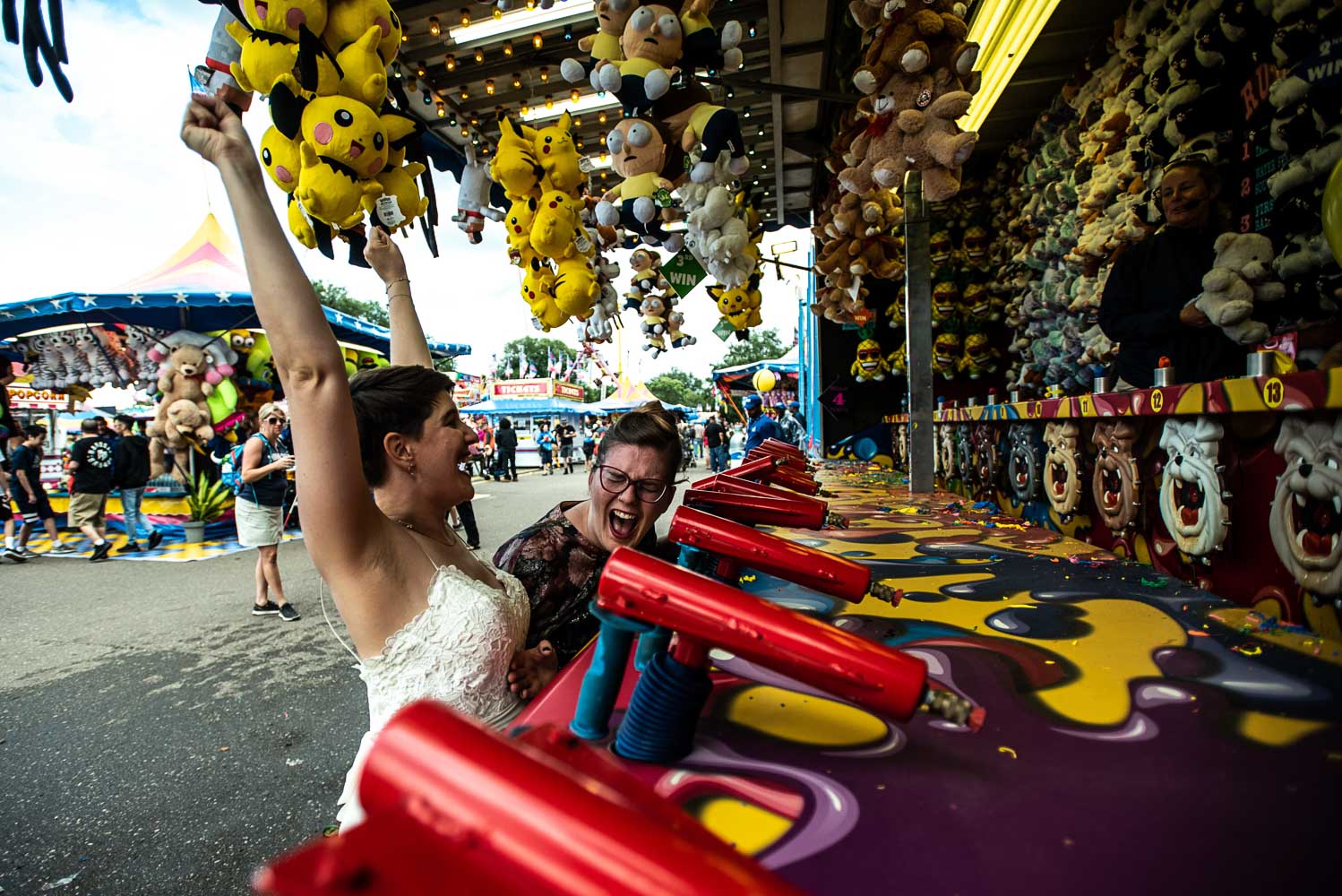 same sex couple playing at the Minnesota State Faircarnival games 