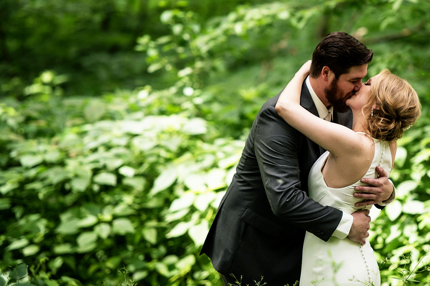 first kiss on the wedding day during the first look