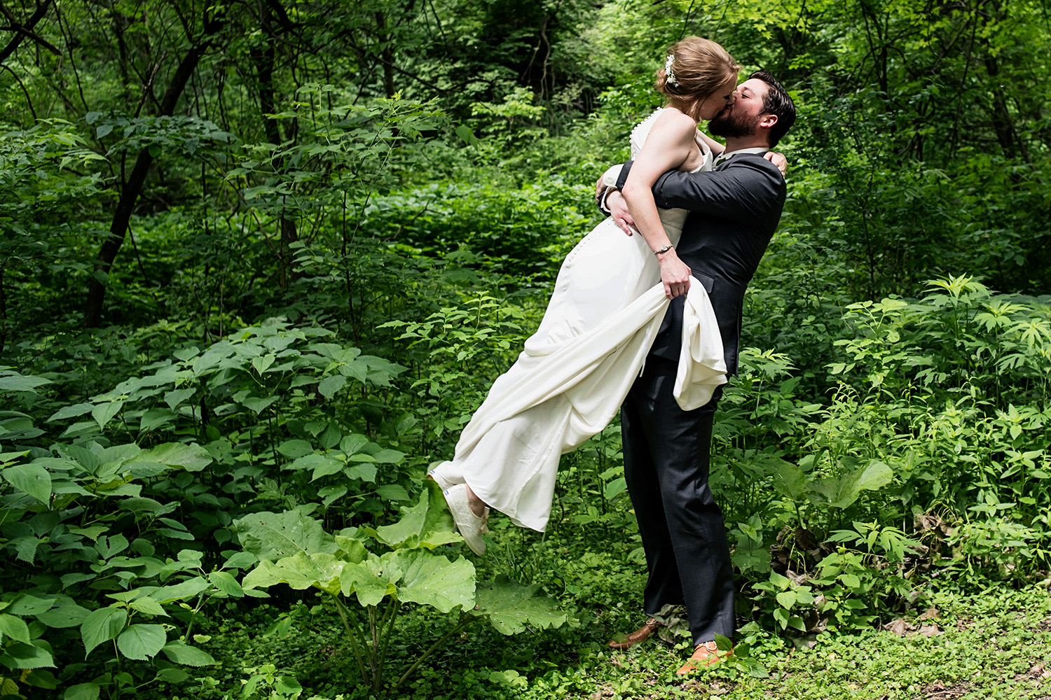bride and groom in the woods for their first look in St Paul Minnesota