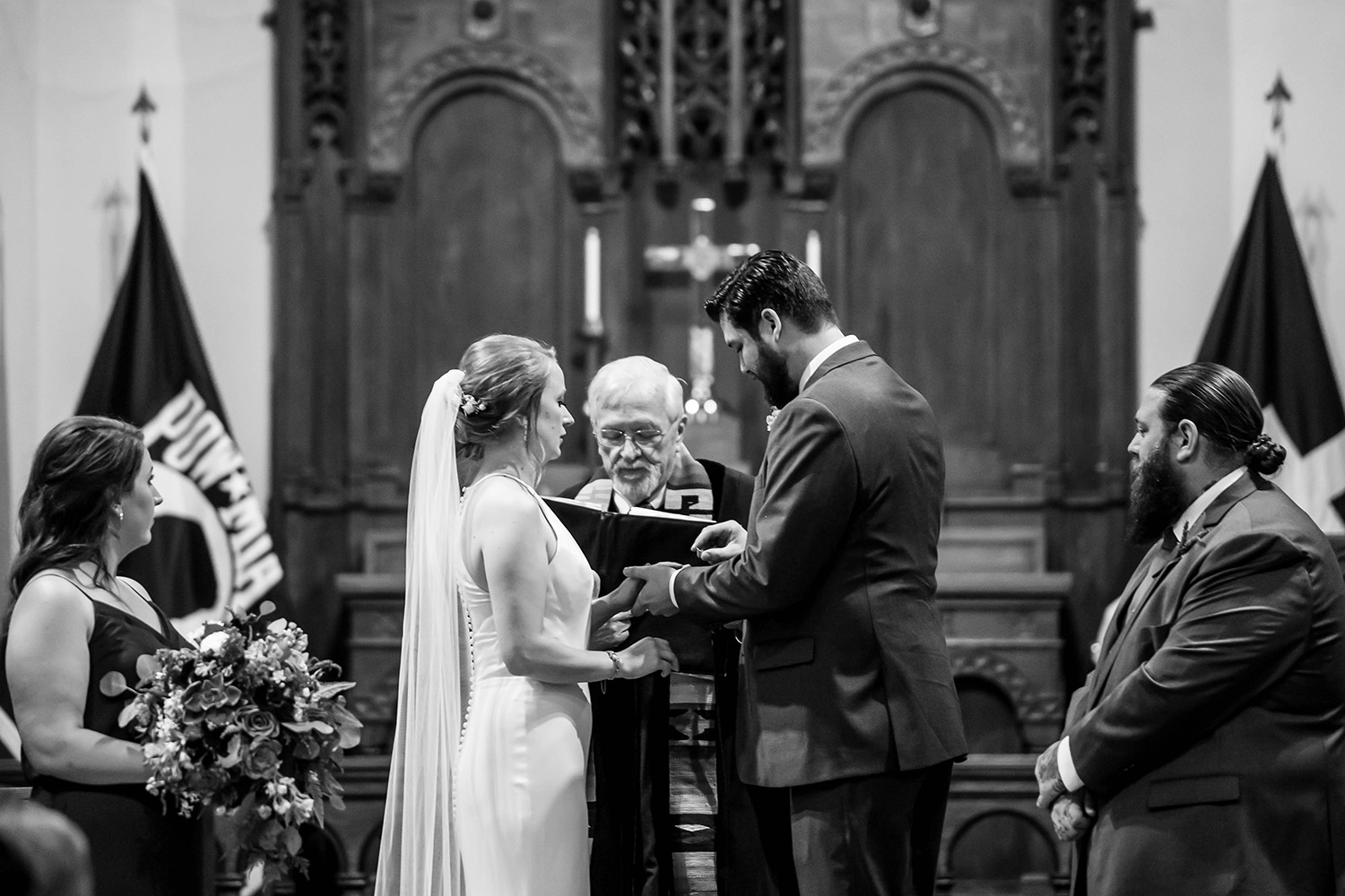 bride and groom exchanging vows at Fort Snelling chapel