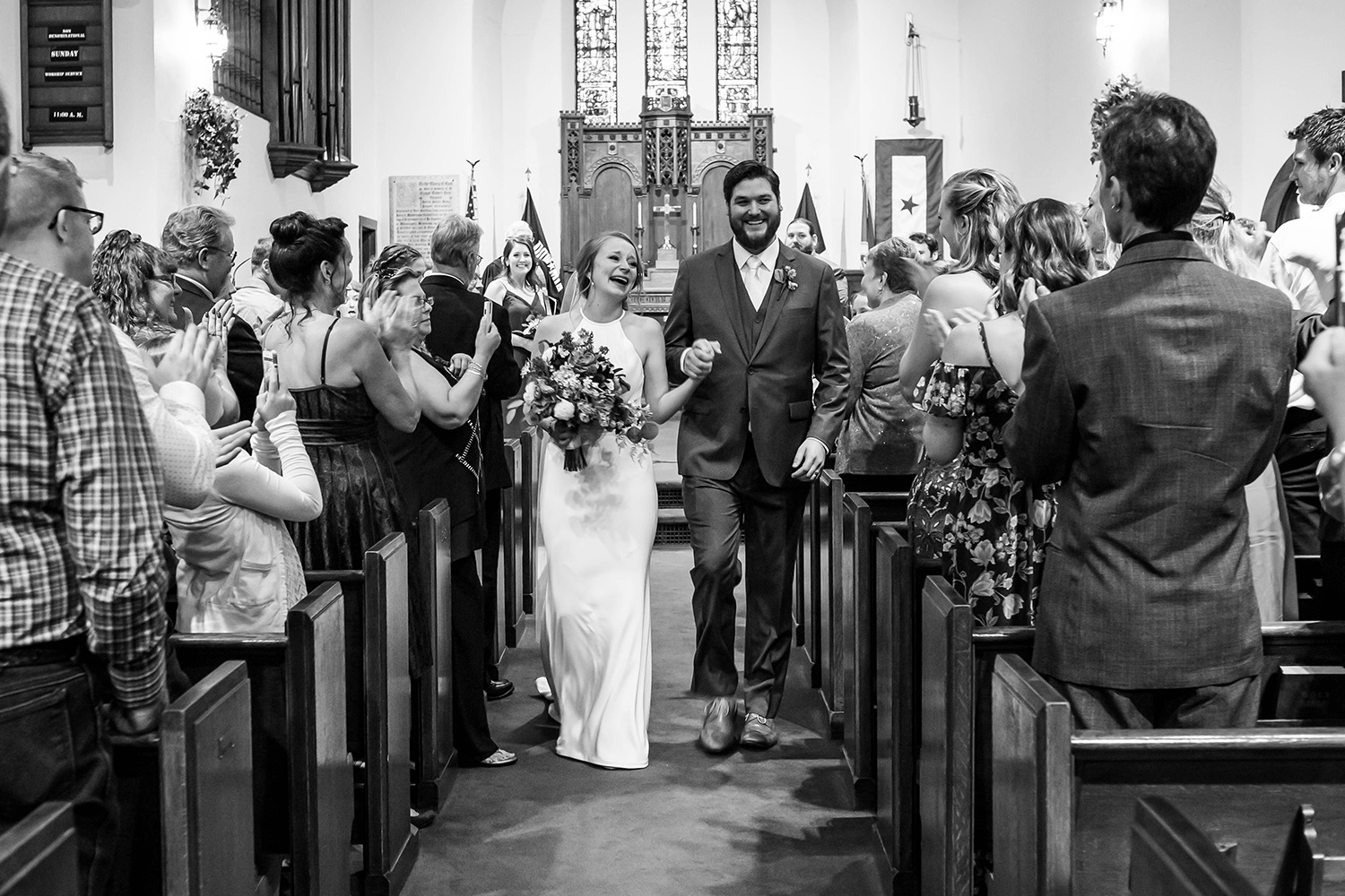 bride and groom during the recessional at Fort Snelling Chapel