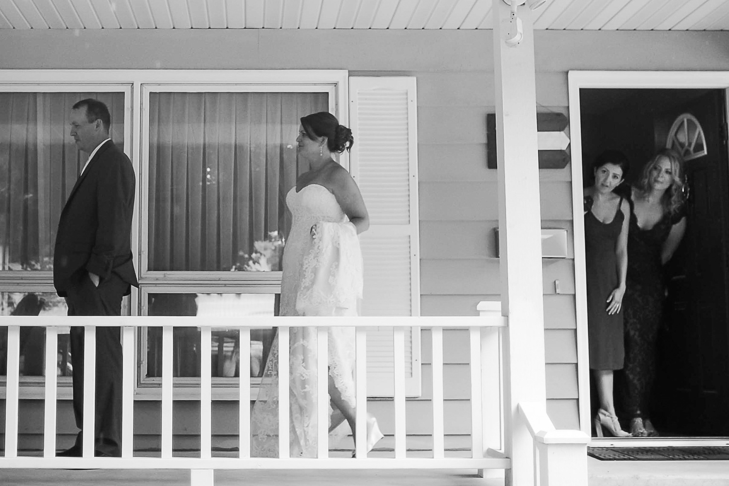 bride and groom's first look on the porch