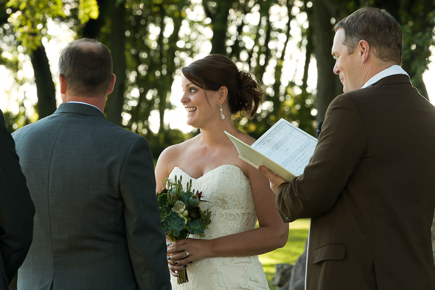 bride and groom at their ceremony on the family farm in Iowa