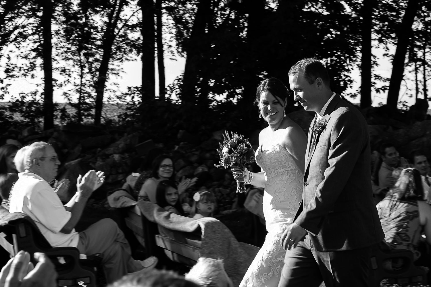bride and groom laughing during their ceremony at their Iowa Farm wedding