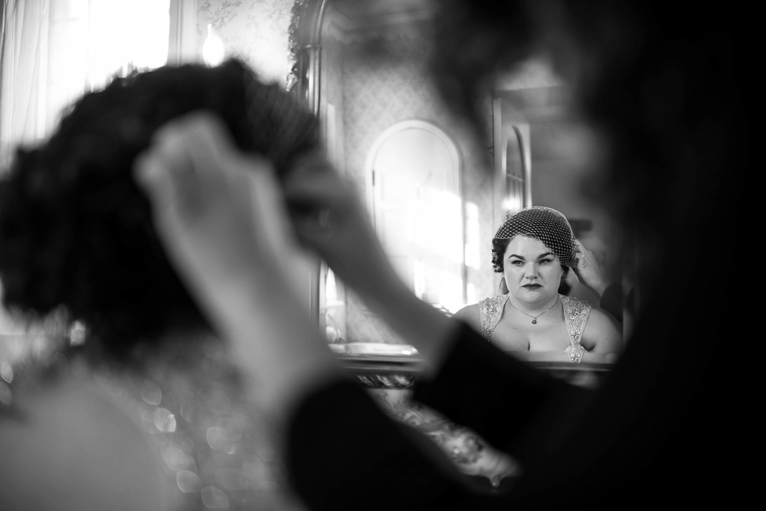 bride getting her veil on before her wedding